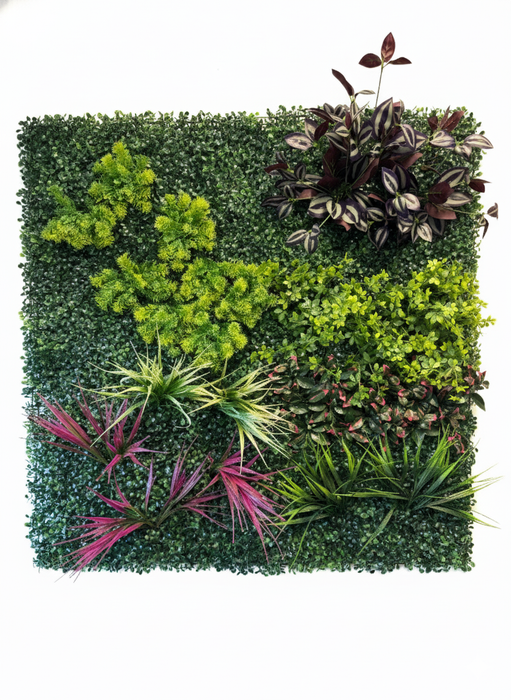 Artificial green wall panel with various green plants pink and purple accents