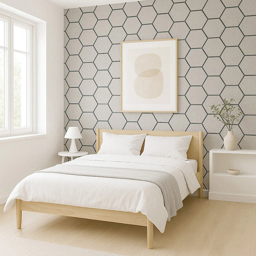 Modern bedroom with light wood bed, white bedding, and geometric wall pattern.
