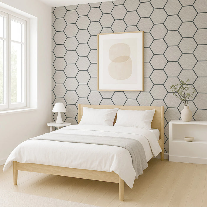 Modern bedroom with light wood bed, white bedding, and geometric wall pattern.